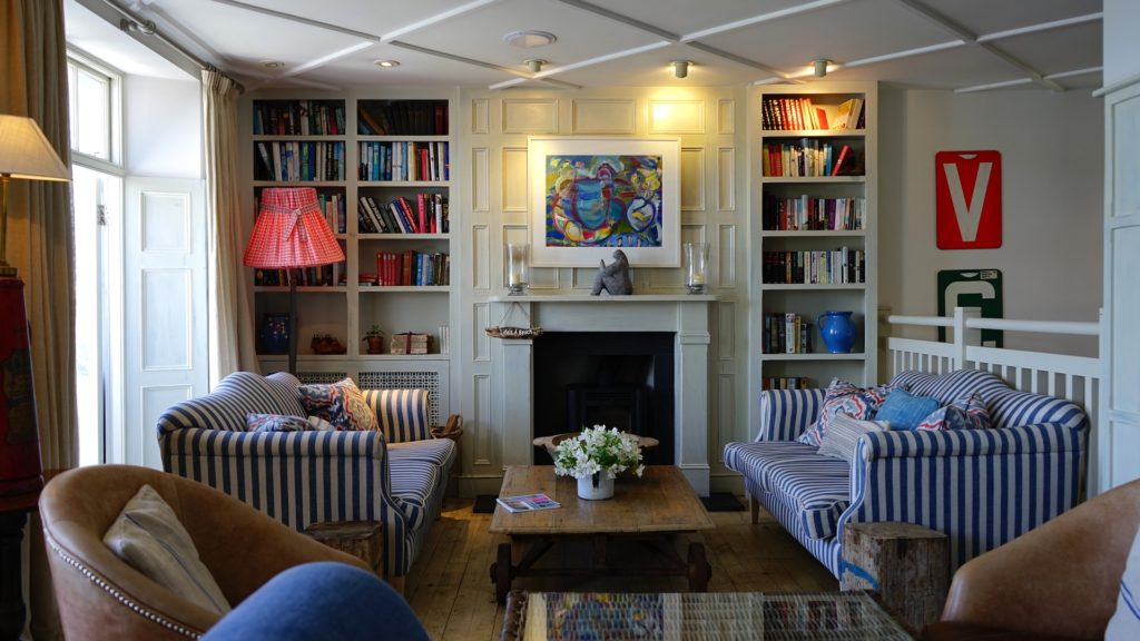 living room with built in cabinets and fire place