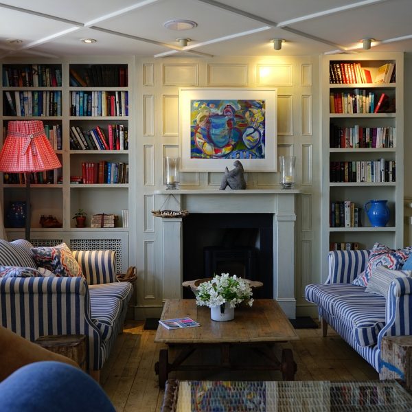 living room with built in cabinets and fire place